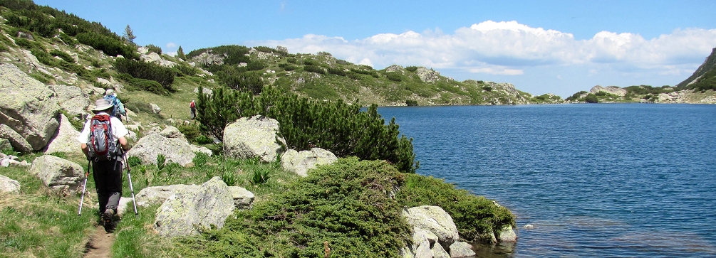 Photo of hikers at Popovo Ezero (Priest Lake) in the Pirin Mountains of Bulgaria