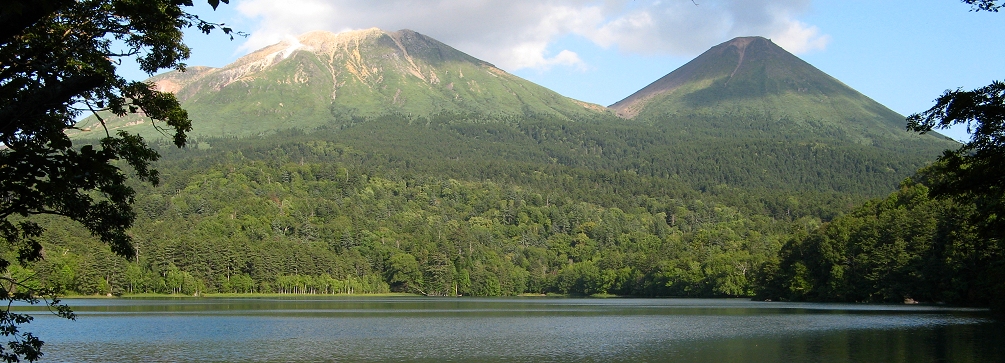Meakandake and Akan Fuji volcanoes rising above the lake of Onneto, Akan National Park, Hokkaido, Japan