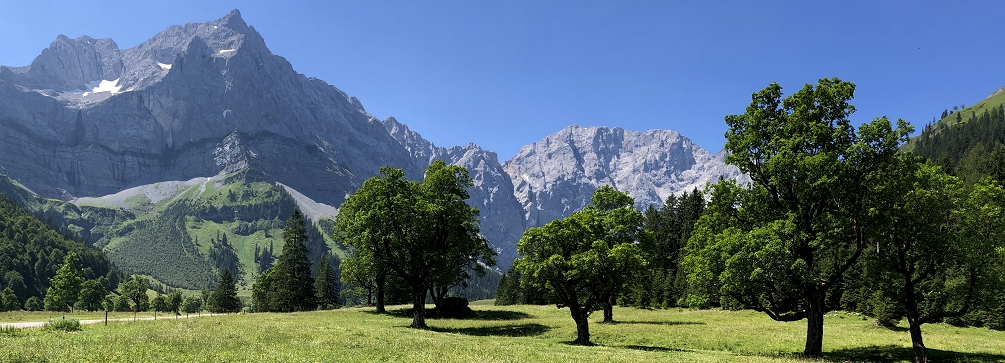 Expansive meadows at the foot of the Karwendel Alpen
