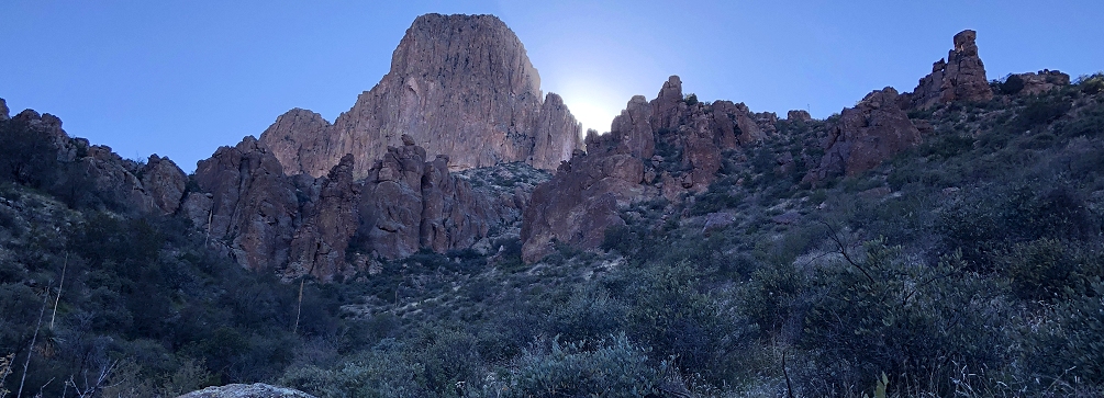 The afternoon sun backlights the east face of the Weaver's Needle, Superstition Mountains